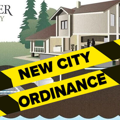 illustrated home in mower county with ellow and black caution tape which reads "New City Ordinance"